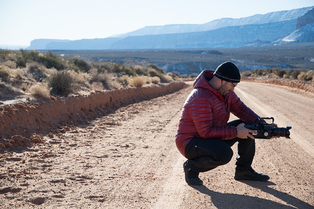 Image of film crew in desert road.